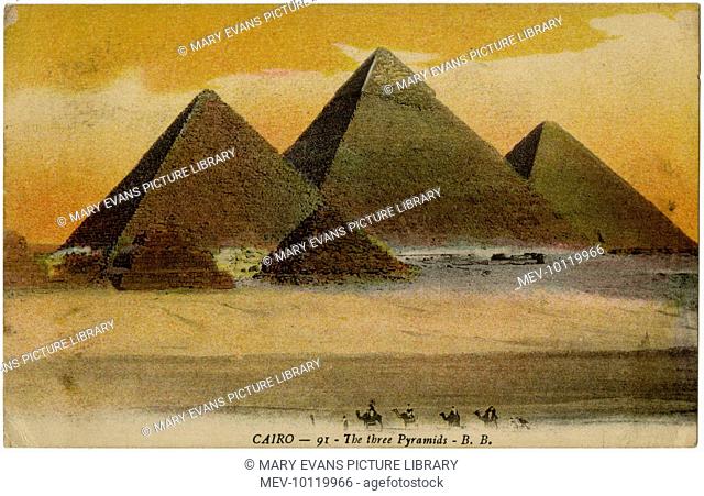 The three massive principal pyramids at Giza, one of the seven wonders of the ancient world. The Great Pyramid of Cheops retains some of it's original stonework...