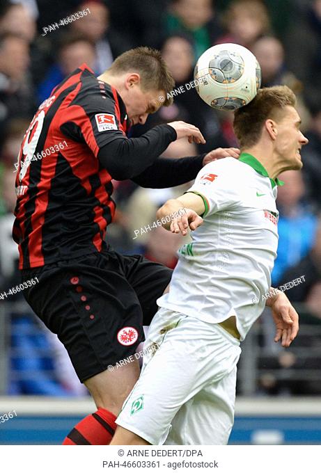 Frankfurt's Alexander Madlung (L)vies for the ball with Bremen's Nils Petersen during the German Bundesliga match between Eintracht Frankfurt and SV Werder...