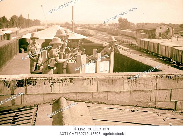 British troops with machine gun on Lydda Junction Station roof, Oct. 31, 1938. 1938, Israel, Lod