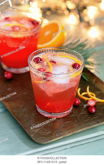 A cranberry cocktail with redcurrant and orange (Christmas)