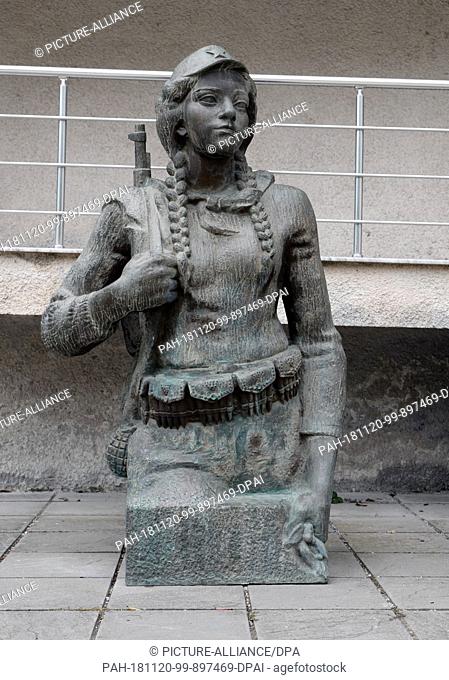 28 October 2018, Albania, Tirana: The bronze figure of a female freedom fighter stands on the outdoor area of the National Gallery