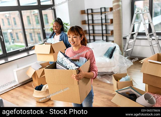 women with boxes moving to new home