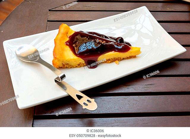 Blueberry Cheesecake with little spoon on a plate