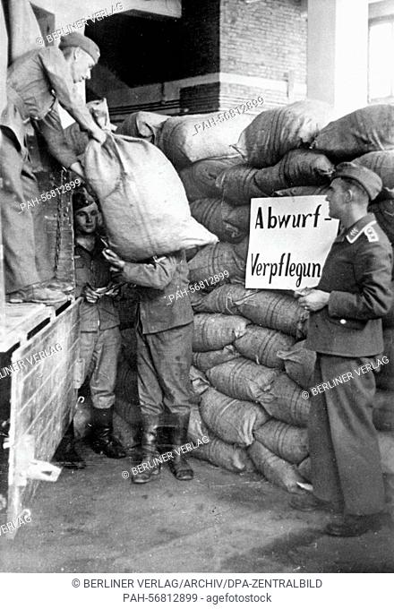 The Nazi propaganda picture from May/June 1941 shows German soldiers on the Greek island of Crete loading bags of groceries for the troops fighting on Crete