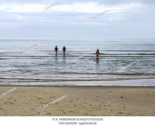 Hirtshals, Denmark Three women bathing early in the morning in the North Sea