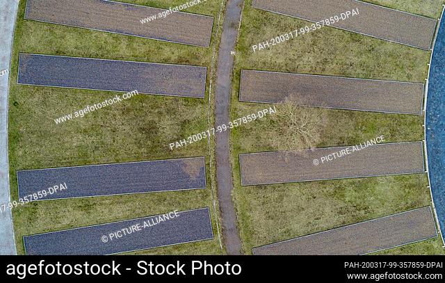 04 March 2020, Brandenburg, Oranienburg: Outlines of the former camp barracks on the grounds of the Sachsenhausen Memorial (aerial photograph taken with a...
