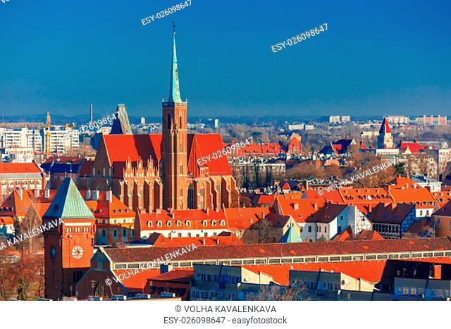 Aerial view of Ostrow Tumski with church of the Holy Cross and St. Bartholomew from St. Mary Magdalene Church in the morning in Wroclaw, Poland
