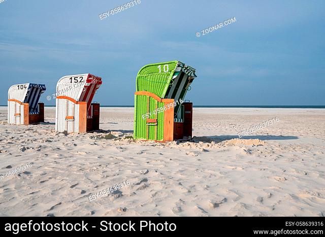 Beach chairs at the coastline of Amrum, North Frisia, Germany