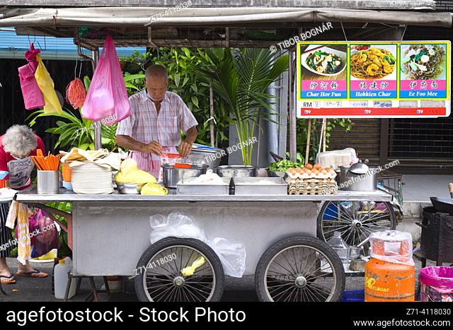 Malaysia, Penang, Georgetown, street food, cook. Penang is known as Malaysia's street food capital, with the city of Georgetown being the culinary hub of the...