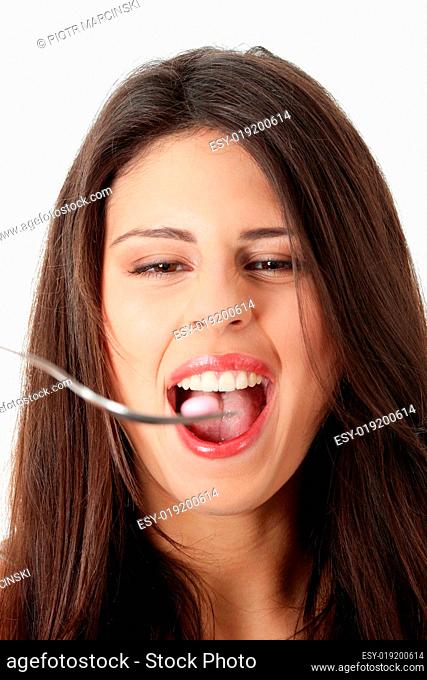 Woman eating a pill
