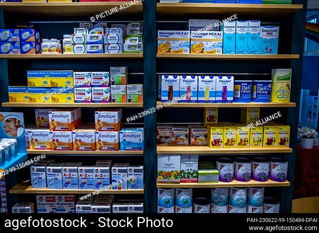 PRODUCTION - 30 May 2023, Mecklenburg-Western Pomerania, Schwerin: Dietary supplements and cosmetics stand on a sales shelf in the Rainbow Pharmacy