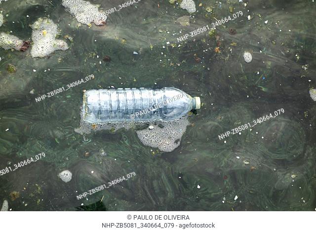 Plastic bottle floating at the sea. We are eating plastic on our seafood. Contaminated fish and shellfish have been found everywhere from Europe