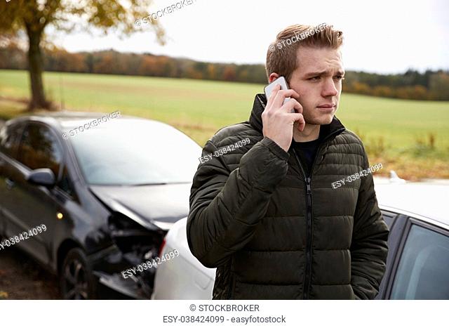 Man Calling To Report Car Accident On Country Road
