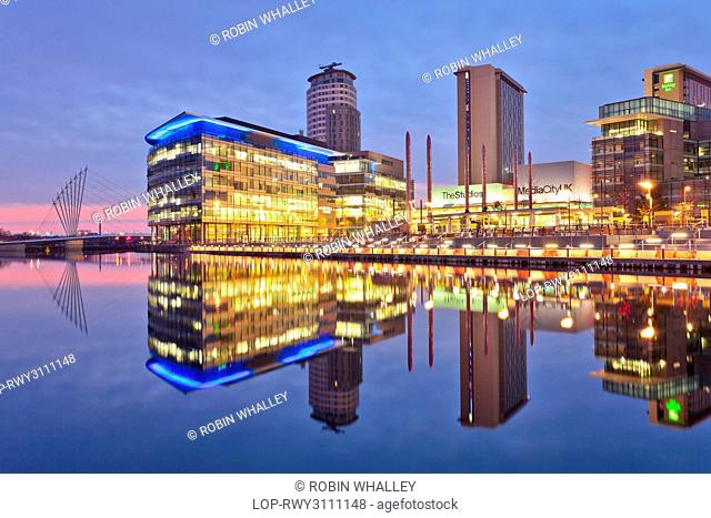 England, Greater Manchester, Manchester. View across Salford Quays to the new MediaCityUK development on Pier 9. The BBC are due to complete the move of five...