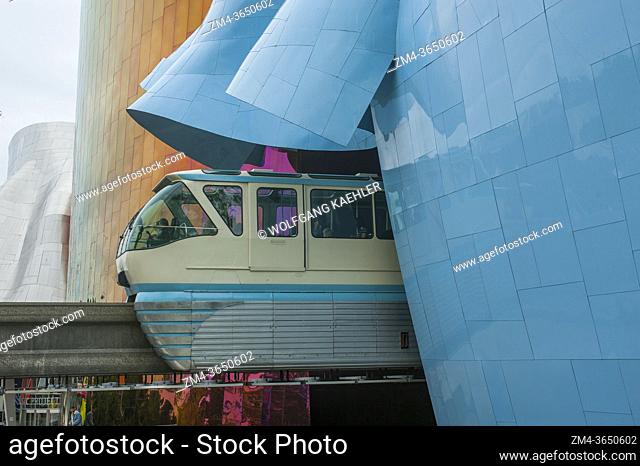 The monorail stopping at the station at the Museum of Pop Culture (designed by Frank O. Gehry) at the Seattle Center in Seattle, Washington State, USA