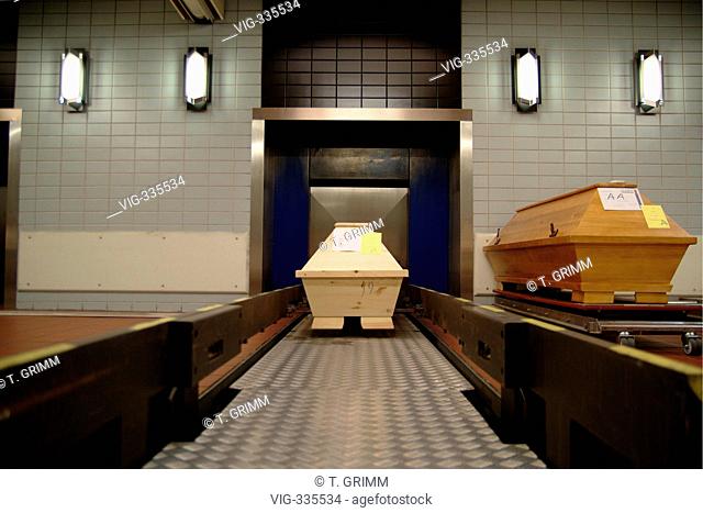Cremation in Hamburg crematorium on the cemetery Hamburg Oejendorf. The picture shows coffins in front of the automatical entrance to the burner with about 1000...