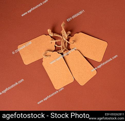 empty paper brown rectangular price tag on a rope, top view