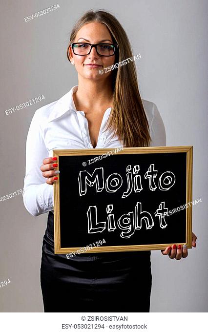 Mojito Light - Young businesswoman holding chalkboard with text - vertical image