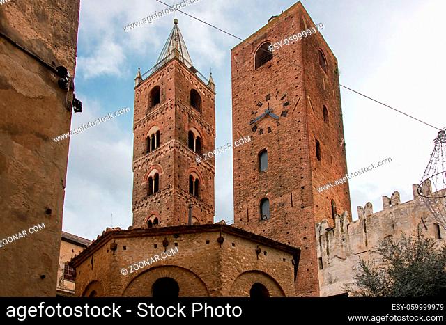 The belfry of the Cathedral and the Clock Tower, medieval landmarks in the old town of the ligurian village of Albenga