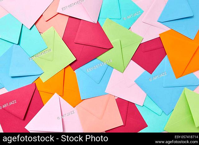 Creative background from handcraft colored blank envelopes and letters