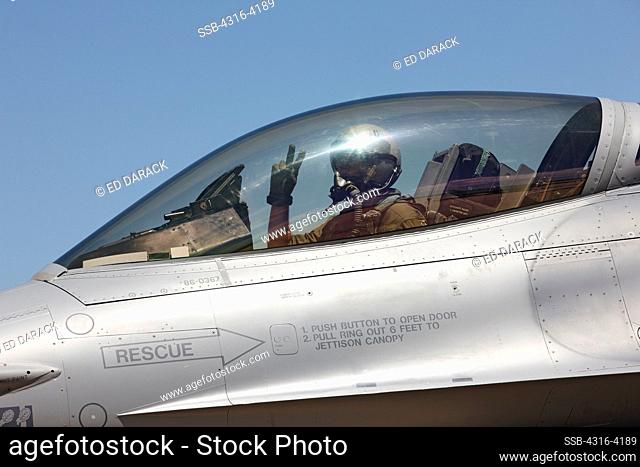 Pilot of an F-16 Makes Peace Sign Gesture