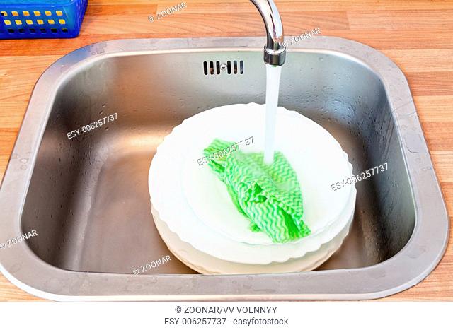 wash-up by dishcloth