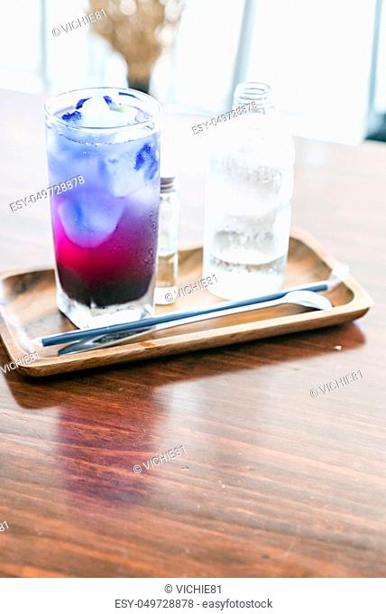 Butterfly pea ice cube server with soda water