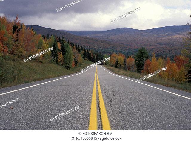 fall foliage, road, Vermont, The double yellow lines of Route 109 follow the colorful fall foliage through the scenic countryside of Belvedere