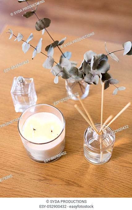 aroma reed diffuser, burning candle and perfume