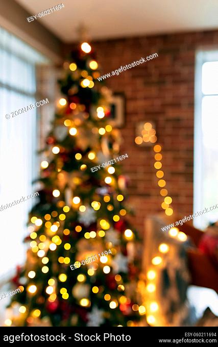 Bokeh lights of christmas tree, blurred christmas tree at house. High quality photo