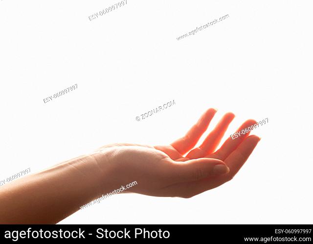 Hand in gesture of holding, giving. Strong backlight, isolated on white. Perfect for product placement