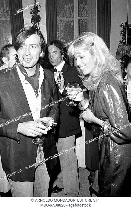 French showgirl Amanda Lear (Amanda Tapp) and her husband Alain-Philippe Malagnac at a cocktail. Paris, 1979