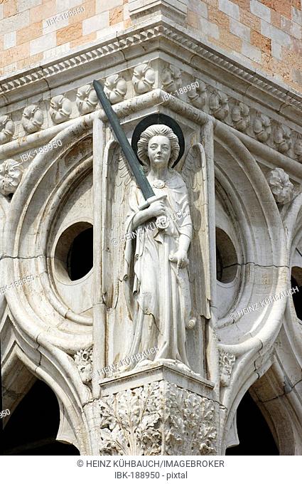 Lady Justice with sword and scroll at the Doge's Palace, Piazza San Marco, Venice, Veneto, Italy