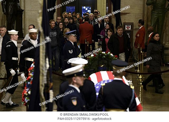People arrive to pay their respects to former US President George H. W. Bush as he lies in state in the US Capitol's rotunda December 3, 2018 in Washington, DC