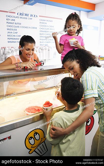 Family getting ice cream in ice cream shop