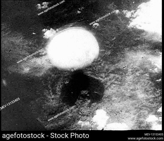 A Mushroom Cloud Growing From the Detonation of a Nuclear Device