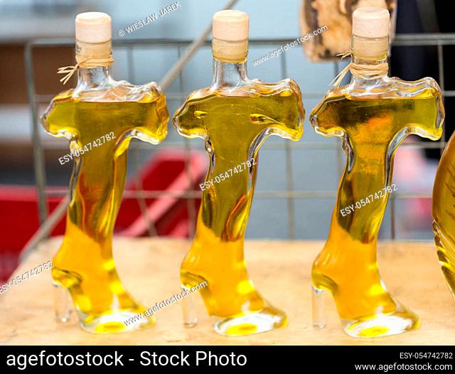 ROME, ITALY - JUNE 15, 2015: Rome - Campo dei Fiori. Shopboard with bottles puring virgin olive