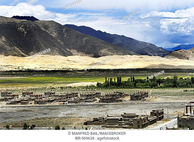 New buildings, mountains and dunes, Samye near Lhasa, Tibet, Asia
