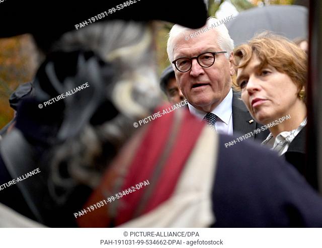 31 October 2019, US, Boston: Federal President Frank-Walter Steinmeier and his wife Elke Büdenbender are accompanied on a walk through the Minute Man National...