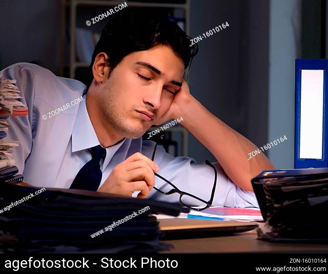 The young businessman working overtime late in office