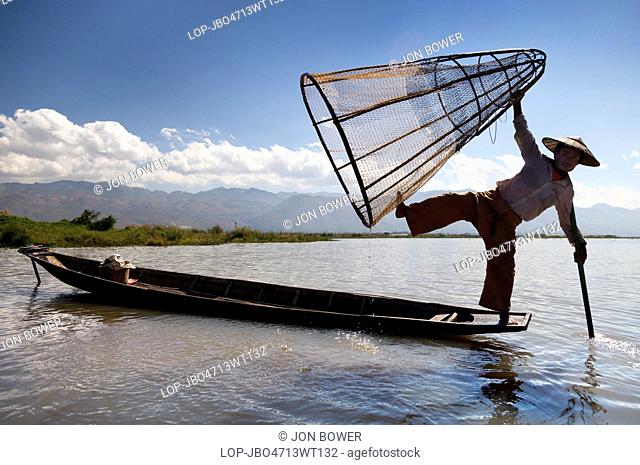 Myanmar, Shan, Lake Inle. Fisherman with unusual conical nets on Lake Inle in Myanmar