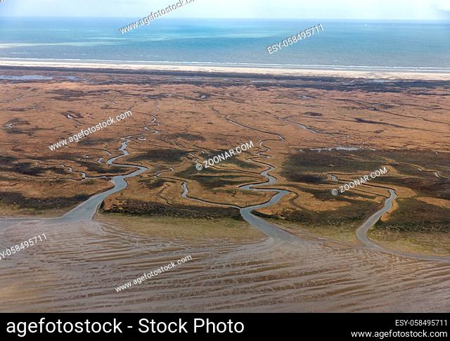 Aerial view Dutch island Schiermoniikoog, coastline with wetlands, mudflats and natural channels