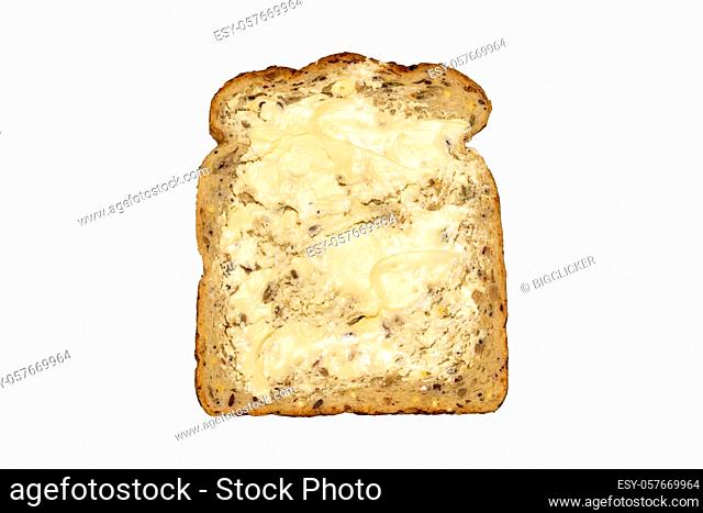 Wholemeal sliced bread and butter which has breakfast health benefits cut out and isolated on a white background, close up studio shot stock photo image