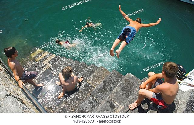 Children diving in, Castro Urdiales, Cantabria, Spain