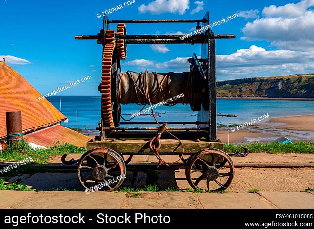 An old rope winch on the North Sea coast in Runswick Bay, North Yorkshire, England, UK
