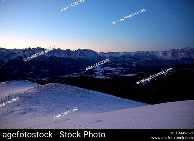 Dawn, winter hiking, ski tour to Simetsberg. View towards Karwendel mountains, Germany, Bavaria, Walchensee, Einsiedl
