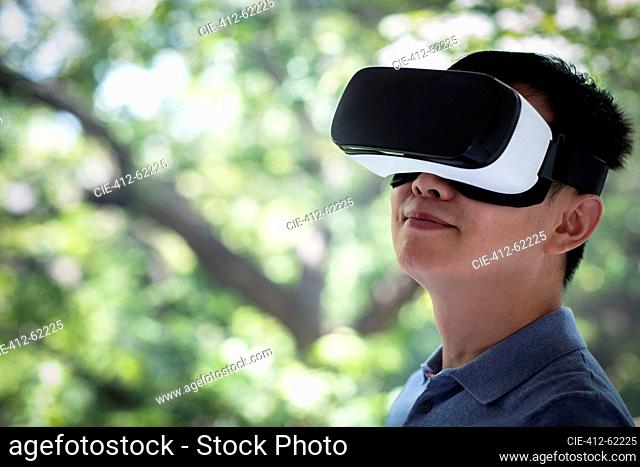 Close up man using VR headset