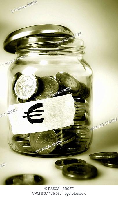 Close-up of a jar of European union coins