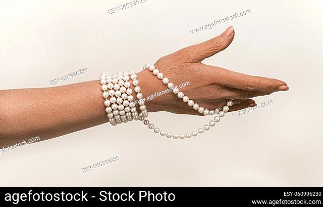 Beautiful shot of old woman hand on white background for concept design. Isolated old female portrait. Human life concept. White background