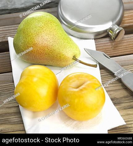 Pear and yellow plums, close-up